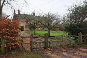 How Is Wood Farm Cottage Involved in the Transition